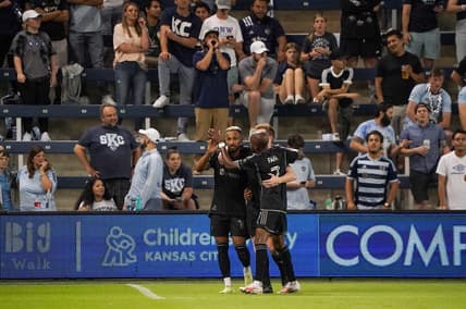 Sep 20, 2023; Kansas City, Kansas, USA; Nashville SC midfielder Hany Mukhtar (10) celebrates his goal scored against Sporting Kansas City with midfielder Dax McCarty (6) and midfielder Fafa Picault (7) during the second half at Children's Mercy Park. Mandatory Credit: Denny Medley-USA TODAY Sports
