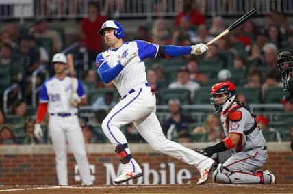 Sep 30, 2023; Atlanta, Georgia, USA; Atlanta Braves third baseman Austin Riley (27) hits a double against the Washington Nationals in the first inning at Truist Park. Mandatory Credit: Brett Davis-USA TODAY Sports