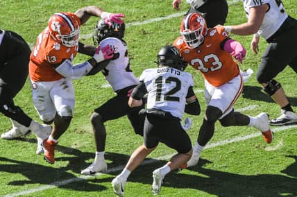 Oct 7, 2023; Clemson, South Carolina, USA; Clemson defensive tackle Ruke Orhorhoro (33) sacks  Wake Forest quarterback Mitch Griffis (12) during the first quarter at Memorial Stadium. Mandatory Credit: Ken Ruinard-USA TODAY Sports