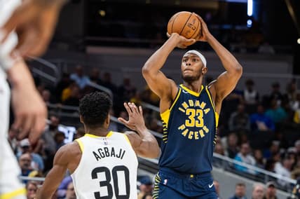Nov 8, 2023; Indianapolis, Indiana, USA; Indiana Pacers center Myles Turner (33) shoots the ball while Utah Jazz guard Ochai Agbaji (30) defends in the second half at Gainbridge Fieldhouse. Mandatory Credit: Trevor Ruszkowski-USA TODAY Sports