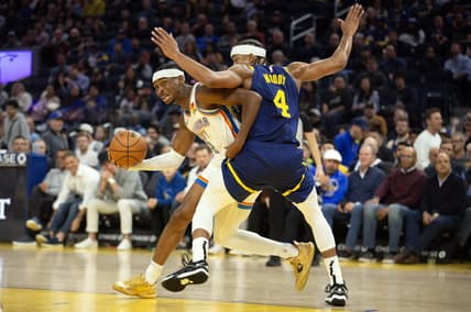 Nov 16, 2023; San Francisco, California, USA; Oklahoma City Thunder guard Shai Gilgeous-Alexander (2) commits an offensive foul on Golden State Warriors guard Moses Moody (4) during the second quarter at Chase Center. Mandatory Credit: D. Ross Cameron-USA TODAY Sports