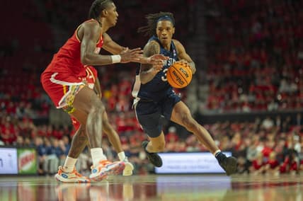 Dec 6, 2023; College Park, Maryland, USA;  Penn State Nittany Lions guard Nick Kern Jr. (3) dribble by Maryland Terrapins forward Julian Reese (10) during the first half at Xfinity Center. Mandatory Credit: Tommy Gilligan-USA TODAY Sports