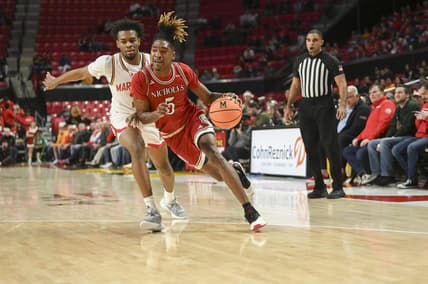Dec 19, 2023; College Park, Maryland, USA;  Nicholls State Colonels forward Diante Smith (5) dribble by Maryland Terrapins guard Jahari Long (2) during the first half at Xfinity Center. Mandatory Credit: Tommy Gilligan-USA TODAY Sports