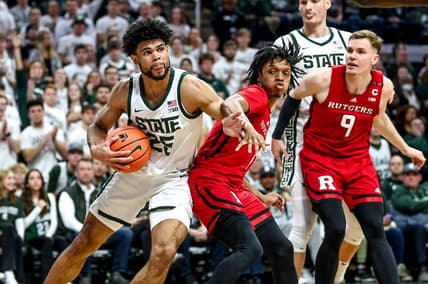 Michigan State's Malik Hall, left, looks for room as Rutgers' Jamichael Davis defends during the first half on Sunday, Jan. 14, 2024, at the Breslin Center in East Lansing.