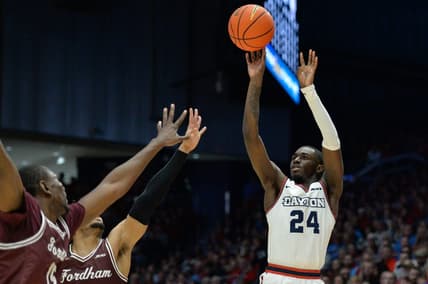 Feb 17, 2024; Dayton, Ohio, USA;  Dayton Flyers guard Kobe Elvis (24) shoots the ball against Fordham guard Antrell Charlton (24) during the game at University of Dayton Arena. Mandatory Credit: Matt Lunsford-USA TODAY Sports
