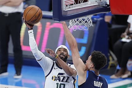 May 14, 2021; Oklahoma City, Oklahoma, USA; Utah Jazz guard Mike Conley (10) shoots as Oklahoma City Thunder center Isaiah Roby (22) defends during the first quarter at Chesapeake Energy Arena. Mandatory Credit: Alonzo Adams-USA TODAY Sports