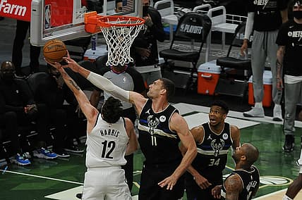 Jun 17, 2021; Milwaukee, Wisconsin, USA; Milwaukee Bucks center Brook Lopez (11) blocks the shot of Brooklyn Nets forward Joe Harris (12) in the first quarter during game six in the second round of the 2021 NBA Playoffs at Fiserv Forum. Mandatory Credit: Michael McLoone-USA TODAY Sports