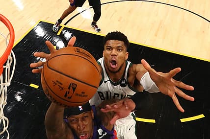 Jul 17, 2021; Phoenix, Arizona, USA; Milwaukee Bucks forward Giannis Antetokounmpo (34) battles for a rebound against Phoenix Suns forward Torrey Craig (12) during game five of the 2021 NBA Finals at Phoenix Suns Arena. Mandatory Credit: Mark J. Rebilas-USA TODAY Sports