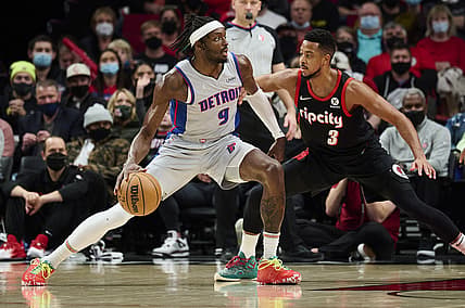 Nov 30, 2021; Portland, Oregon, USA; Portland Trail Blazers guard CJ McCollum (3) guards Detroit Pistons forward Jerami Grant (9) during the first half at Moda Center. Mandatory Credit: Troy Wayrynen-USA TODAY Sports