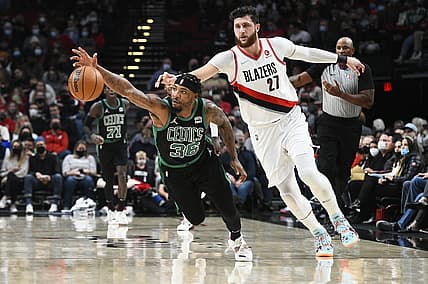 Dec 4, 2021; Portland, Oregon, USA; Boston Celtics guard Marcus Smart (36) steals the ball away from Portland Trail Blazers center Jusuf Nurkic (27) during the first half at Moda Center. Mandatory Credit: Troy Wayrynen-USA TODAY Sports