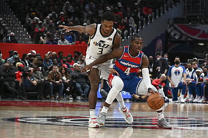 Dec 11, 2021; Washington, District of Columbia, USA;  Washington Wizards guard Aaron Holiday (4) dribbles as Utah Jazz guard Trent Forrest (3) defends during the first half at Capital One Arena. Mandatory Credit: Tommy Gilligan-USA TODAY Sports