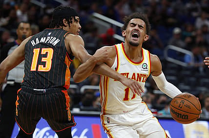 Dec 15, 2021; Orlando, Florida, USA; Orlando Magic guard R.J. Hampton (13) fouls Atlanta Hawks guard Trae Young (11) during the first quarter at Amway Center. Mandatory Credit: Kim Klement-USA TODAY Sports