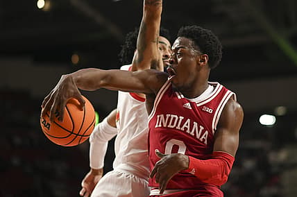 Jan 29, 2022; College Park, Maryland, USA;  Indiana Hoosiers guard Xavier Johnson (0) pass around Maryland Terrapins guard Eric Ayala (5) during the the first half at Xfinity Center. Mandatory Credit: Tommy Gilligan-USA TODAY Sports