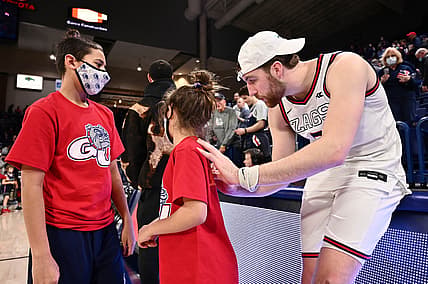 Feb 19, 2022; Spokane, Washington, USA; Gonzaga Bulldogs forward Drew Timme (2) signs an autograph after a game against the Santa Clara Broncos at McCarthey Athletic Center. Gonzaga won 81-69. Mandatory Credit: James Snook-USA TODAY Sports