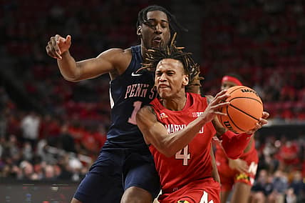Feb 21, 2022; College Park, Maryland, USA;  Maryland Terrapins guard Fatts Russell (4) makes a moe to the basket by Penn State Nittany Lions forward Jevonnie Scott (13)  during the second half at Xfinity Center. Mandatory Credit: Tommy Gilligan-USA TODAY Sports