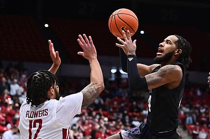 Feb 23, 2022; Pullman, Washington, USA; Washington Huskies guard PJ Fuller (4) shoots the ball against Washington State Cougars guard Michael Flowers (12) in the first half at Friel Court at Beasley Coliseum. Mandatory Credit: James Snook-USA TODAY Sports