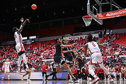 Feb 23, 2022; Pullman, Washington, USA; Washington State Cougars forward Mouhamed Gueye (35) shoots the ball against the Washington Huskies in the second half at Friel Court at Beasley Coliseum. Washington State won 78-70. Mandatory Credit: James Snook-USA TODAY Sports