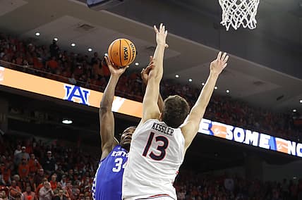 Jan 22, 2022; Auburn, Alabama, USA;  Kentucky Wildcats forward Oscar Tshiebwe (34) takes a shot as Auburn Tigers forward Walker Kessler (13) defends during the first half at Auburn Arena. Mandatory Credit: John Reed-USA TODAY Sports