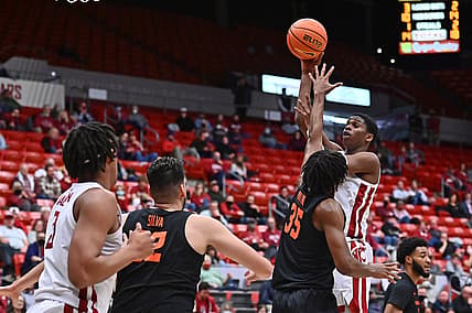 Mar 3, 2022; Pullman, Washington, USA; Washington State Cougars guard Noah Williams (24) shoots the ball against Oregon State Beavers forward Glenn Taylor Jr. (35) in the first half at Friel Court at Beasley Coliseum. Mandatory Credit: James Snook-USA TODAY Sports