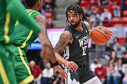 Mar 5, 2022; Pullman, Washington, USA; Washington State Cougars guard Michael Flowers (12) brings the ball down court against the Oregon Ducks in the second half at Friel Court at Beasley Coliseum. Washington St. won 94-74. Mandatory Credit: James Snook-USA TODAY Sports