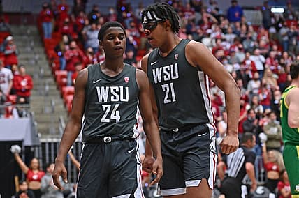 Mar 5, 2022; Pullman, Washington, USA; Washington State Cougars guard Noah Williams (24) and Washington State Cougars center Dishon Jackson (21) celebrate a score and foul against the Oregon Ducks in the second half at Friel Court at Beasley Coliseum. Washington St. won 94-74. Mandatory Credit: James Snook-USA TODAY Sports