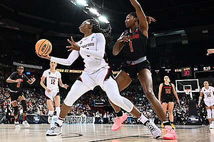 Mar 25, 2022; Spokane, WA, USA; Stanford Cardinal forward Francesca Belibi (5) shoots the ball against Maryland Terrapins guard Diamond Miller (1) in the Spokane regional semifinals of the women's college basketball NCAA Tournament at Spokane Veterans Memorial Arena. Mandatory Credit: James Snook-USA TODAY Sports