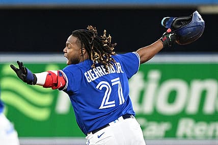 Jun 28, 2022; Toronto, Ontario, CAN;  Toronto Blue Jays first baseman Vladimir Guerrero Jr. (27) celebrates after hitting a walkoff RBI single against the Boston Red Sox in the ninth inning at Rogers Centre. Mandatory Credit: Dan Hamilton-USA TODAY Sports