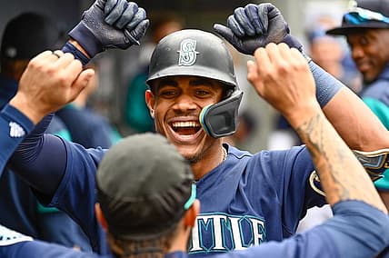 Jun 29, 2022; Seattle, Washington, USA; Seattle Mariners center fielder Julio Rodriguez (44) celebrates in the dugout after hitting a 2-run home run against the Baltimore Orioles during the fourth inning at T-Mobile Park. Mandatory Credit: Steven Bisig-USA TODAY Sports