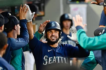 Jul 7, 2022; Seattle, Washington, USA; Seattle Mariners third baseman Eugenio Suarez (28) celebrates in the dugout after hitting a home run against the Toronto Blue Jays during the fifth inning at T-Mobile Park. Mandatory Credit: Steven Bisig-USA TODAY Sports