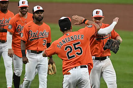 Jul 9, 2022; Baltimore, Maryland, USA;  Baltimore Orioles right fielder Anthony Santander (25) celebrates with  left fielder Austin Hays (21) and teammates after the game against the Los Angeles Angels at Oriole Park at Camden Yards. Mandatory Credit: Tommy Gilligan-USA TODAY Sports