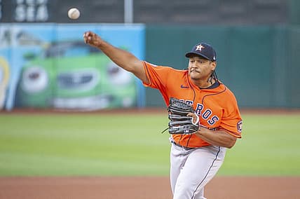 Jul 26, 2022; Oakland, California, USA; Houston Astros starting pitcher Luis Garcia (77) throws a pitch against the Oakland Athletics during the first inning at RingCentral Coliseum. Mandatory Credit: Ed Szczepanski-USA TODAY Sports