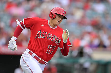 Jul 31, 2022; Anaheim, California, USA; Los Angeles Angels designated hitter Shohei Ohtani (17) rounds the bases on a triple in the first inning against the Texas Rangers at Angel Stadium. Mandatory Credit: Jayne Kamin-Oncea-USA TODAY Sports