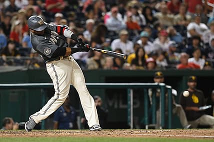 Aug 13, 2022; Washington, District of Columbia, USA;  Washington Nationals designated hitter Nelson Cruz (23) hits an eighth inning single against the Washington Nationals at Nationals Park.  Cruz reached 2000 career hits on the eighth inning at-bat. Mandatory Credit: Tommy Gilligan-USA TODAY Sports