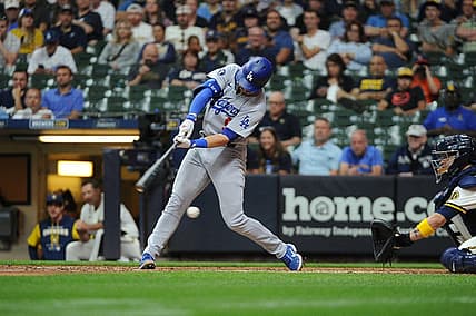 Aug 16, 2022; Milwaukee, Wisconsin, USA; Los Angeles Dodgers second baseman Gavin Lux (9) strikes out against the Milwaukee Brewers in the ninth inning at American Family Field. Mandatory Credit: Michael McLoone-USA TODAY Sports