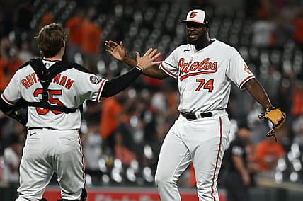 Aug 23, 2022; Baltimore, Maryland, USA;  Baltimore Orioles relief pitcher Felix Bautista (74) celebrates with catcher Adley Rutschman (35) after the game against the Chicago White Sox at Oriole Park at Camden Yards. Mandatory Credit: Tommy Gilligan-USA TODAY Sports