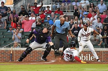 Aug 31, 2022; Cumberland, Georgia, USA; Atlanta Braves catcher William Contreras (24) gets thrown at home in the first inning against the Colorado Rockies at Truist Park. Mandatory Credit: Larry Robinson-USA TODAY Sports