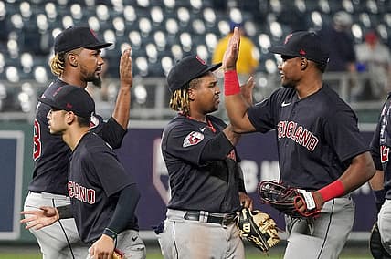 Sep 5, 2022; Kansas City, Missouri, USA; Cleveland Guardians relief pitcher Emmanuel Clase (48) celebrates with third baseman Jose Ramirez (11) and right fielder Oscar Gonzalez (39) against the Kansas City Royals after a game at Kauffman Stadium. Mandatory Credit: Denny Medley-USA TODAY Sports