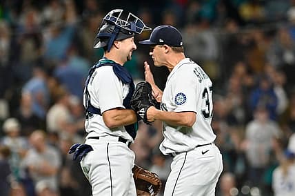 Sep 6, 2022; Seattle, Washington, USA; Seattle Mariners catcher Cal Raleigh (29) and Seattle Mariners relief pitcher Paul Sewald (37) celebrate defeating the Chicago White Sox at T-Mobile Park. Seattle defeated Chicago 3-0. Mandatory Credit: Steven Bisig-USA TODAY Sports