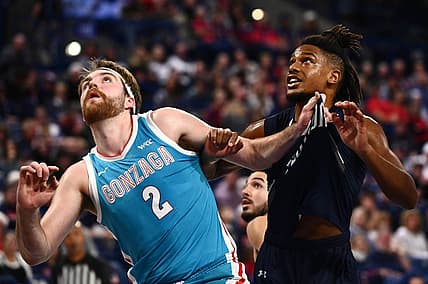 Nov 7, 2022; Spokane, Washington, USA; Gonzaga Bulldogs forward Drew Timme, left, grabs the jersey of North Florida Ospreys guard Chaz Lanier (2) in the first half at McCarthey Athletic Center. Mandatory Credit: James Snook-USA TODAY Sports