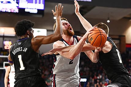 Dec 9, 2022; Spokane, Washington, USA; Gonzaga Bulldogs forward Drew Timme (2) is fouled on the shot by Washington Huskies forward Jackson Grant (12) in the first half at McCarthey Athletic Center. Mandatory Credit: James Snook-USA TODAY Sports