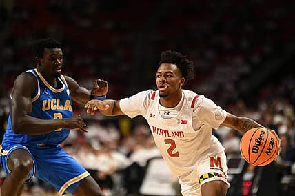 Dec 14, 2022; College Park, Maryland, USA; Maryland Terrapins guard Jahari Long (2) dribble by UCLA Bruins forward Adem Bona (3) during the second half  at Xfinity Center. Mandatory Credit: Tommy Gilligan-USA TODAY Sports
