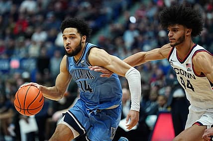 Dec 28, 2022; Hartford, Connecticut, USA; Villanova Wildcats guard Caleb Daniels (14) drives the ball against Connecticut Huskies guard Andre Jackson Jr. (44) during the second half at XL Center. Mandatory Credit: David Butler II-USA TODAY Sports