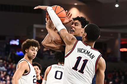 Dec 31, 2022; Spokane, Washington, USA; Pepperdine Waves forward Jevon Porter (14) is fouled by Gonzaga Bulldogs guard Nolan Hickman (11) in the first half at McCarthey Athletic Center. Mandatory Credit: James Snook-USA TODAY Sports