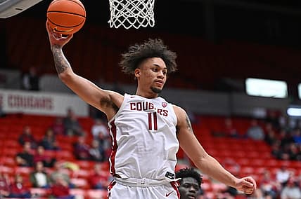 Jan 11, 2023; Pullman, Washington, USA; Washington State Cougars forward DJ Rodman (11) rebounds the ball against the California Golden Bears in the second half at Friel Court at Beasley Coliseum. Mandatory Credit: James Snook-USA TODAY Sports