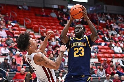 Jan 11, 2023; Pullman, Washington, USA; Washington State Cougars forward DJ Rodman (11) takes a charge from California Golden Bears forward Obinna Anyanwu (23) in the second half at Friel Court at Beasley Coliseum. Mandatory Credit: James Snook-USA TODAY Sports