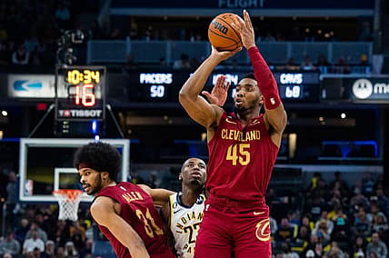 Feb 5, 2023; Indianapolis, Indiana, USA; Cleveland Cavaliers guard Donovan Mitchell (45) shoots the ball while  Indiana Pacers forward Aaron Nesmith (23) defends in the second half at Gainbridge Fieldhouse. Mandatory Credit: Trevor Ruszkowski-USA TODAY Sports