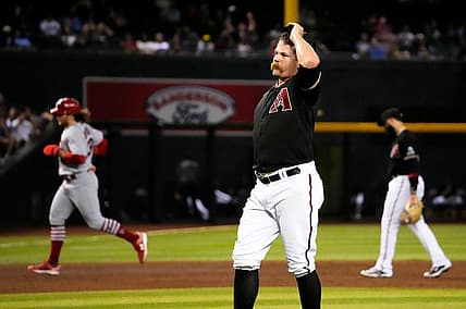 Jul 24, 2023; Phoenix, AZ, USA; Arizona Diamondbacks relief pitcher Andrew Chafin (57) reacts after walking in the winning run against the St. Louis Cardinals in the ninth inning at Chase Field. Mandatory Credit: Rob Schumacher-Arizona Republic
