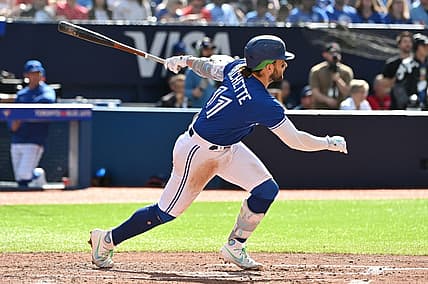 Jul 29, 2023; Toronto, Ontario, CAN;  Toronto Blue Jays shortstop Bo Bichette (11) hits a double against the Los Angeles Angels in the fifth inning at Rogers Centre. Mandatory Credit: Dan Hamilton-USA TODAY Sports