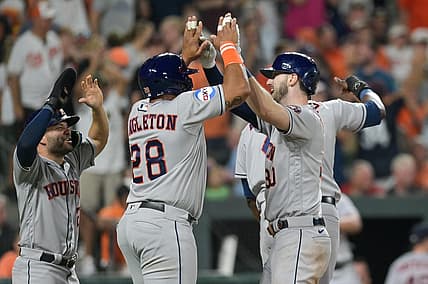 Aug 8, 2023; Baltimore, Maryland, USA; Houston Astros right fielder Kyle Tucker (30) celebrates with pinch hitter John Singleton (28) and second baseman Jose Altuve (27) at home pate after hitting a grand slam in the ninth inning against the Baltimore Orioles  at Oriole Park at Camden Yards. Mandatory Credit: Tommy Gilligan-USA TODAY Sports