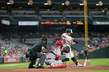 Sep 11, 2023; Baltimore, Maryland, USA;  Baltimore Orioles third baseman Ramon Urias (29) hits a second inning rbi single against the St. Louis Cardinals at Oriole Park at Camden Yards. Mandatory Credit: Tommy Gilligan-USA TODAY Sports